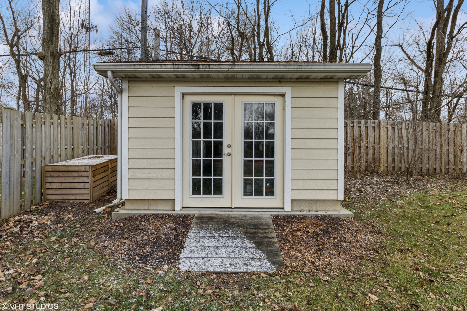 712 Surrey Lane Algonquin, IL 60102 - Photo 17 of 19 a view of a house with a door and wooden walls
