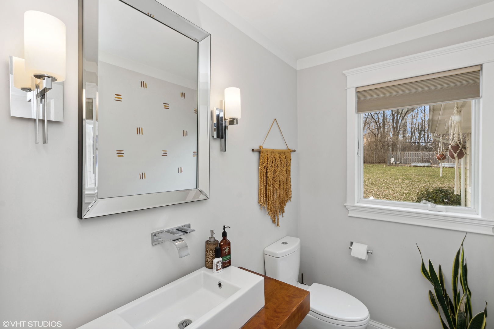 712 Surrey Lane Algonquin, IL 60102 - Photo 7 of 19 a bathroom with a sink a toilet and a mirror