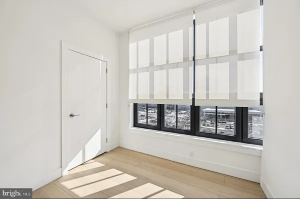 a view of an empty room with windows