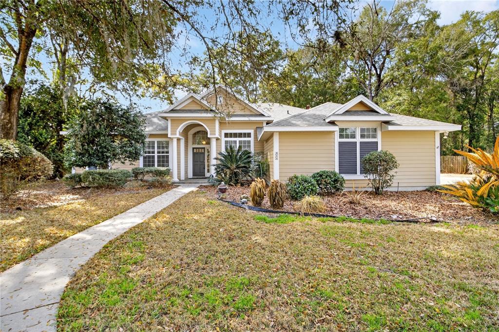 922 Southwest 88 Street Gainesville, FL 32607 - Photo 1 of 1 a front view of a house with a yard