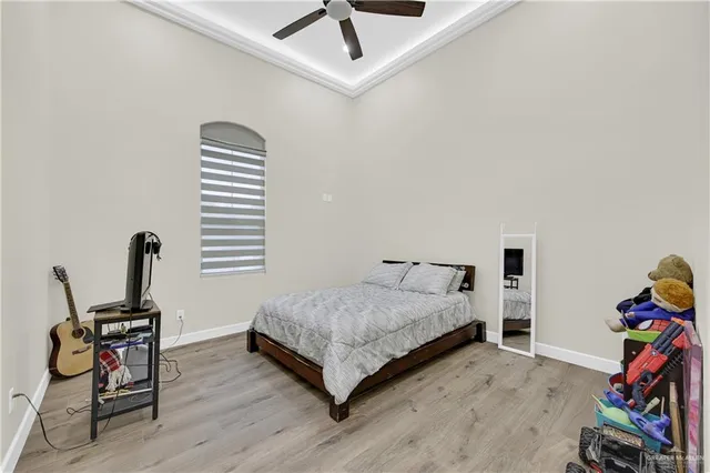 a bedroom with a bed and a chair in it