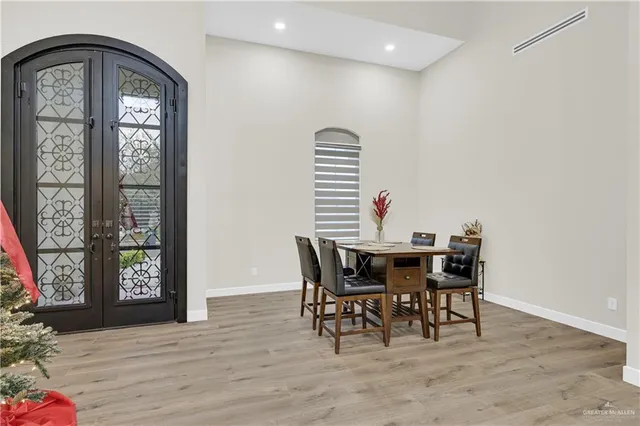 a view of a dining room with furniture and window