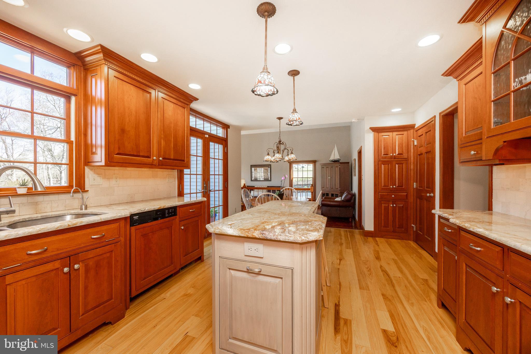 21 Krauser Road Downingtown, PA 19335 - Photo 18 of 54 a kitchen with stainless steel appliances granite countertop wooden cabinets a stove a sink and a wooden floors