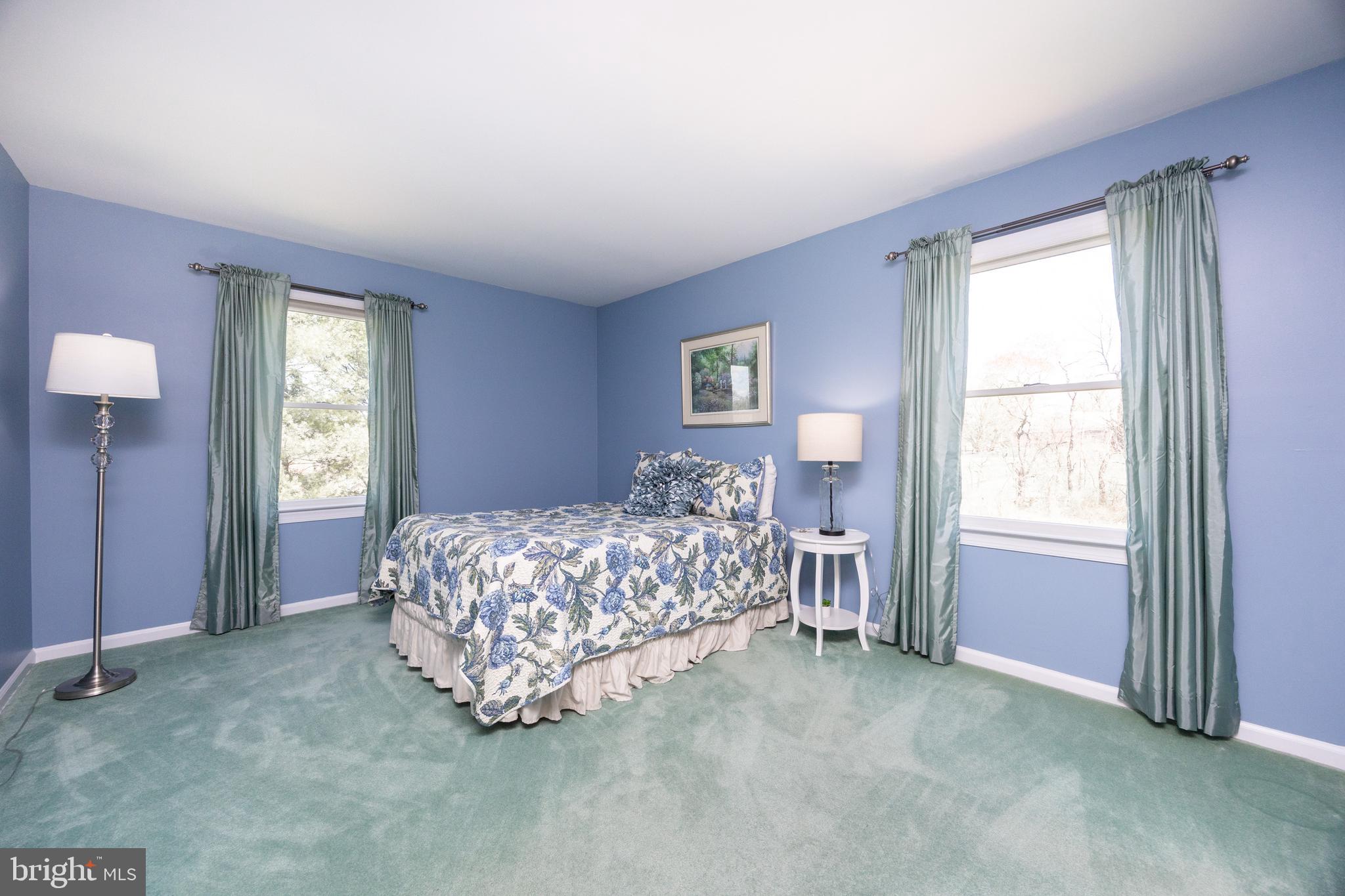 21 Krauser Road Downingtown, PA 19335 - Photo 31 of 54 a bed sitting in a spacious bedroom next to a window and dresser