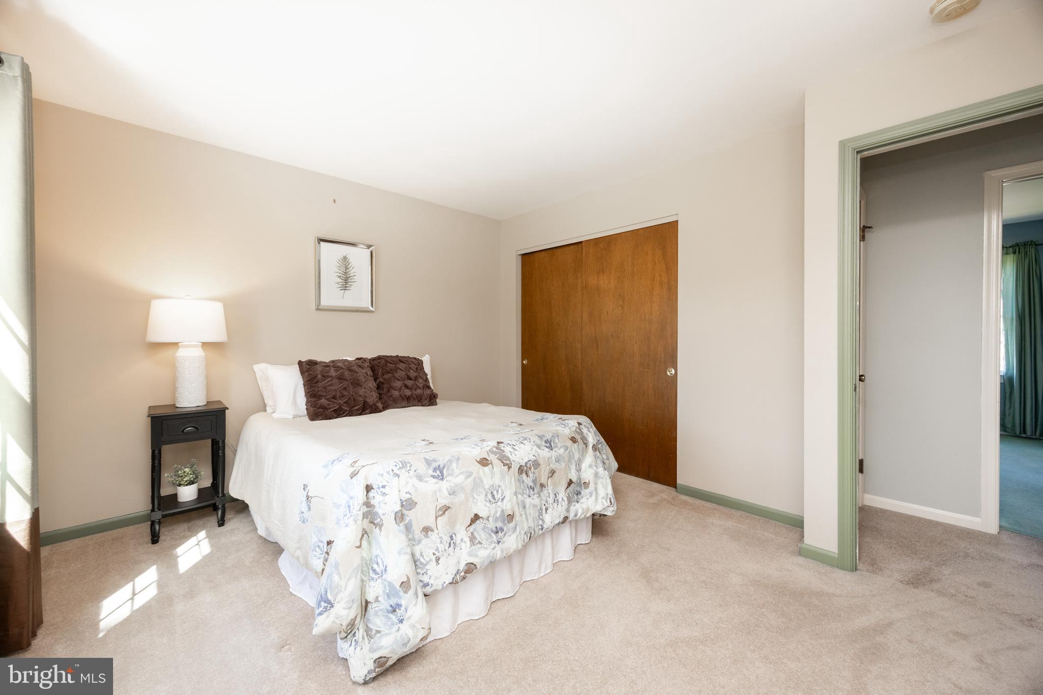 21 Krauser Road Downingtown, PA 19335 - Photo 35 of 54 a bedroom with a bed and a night stand