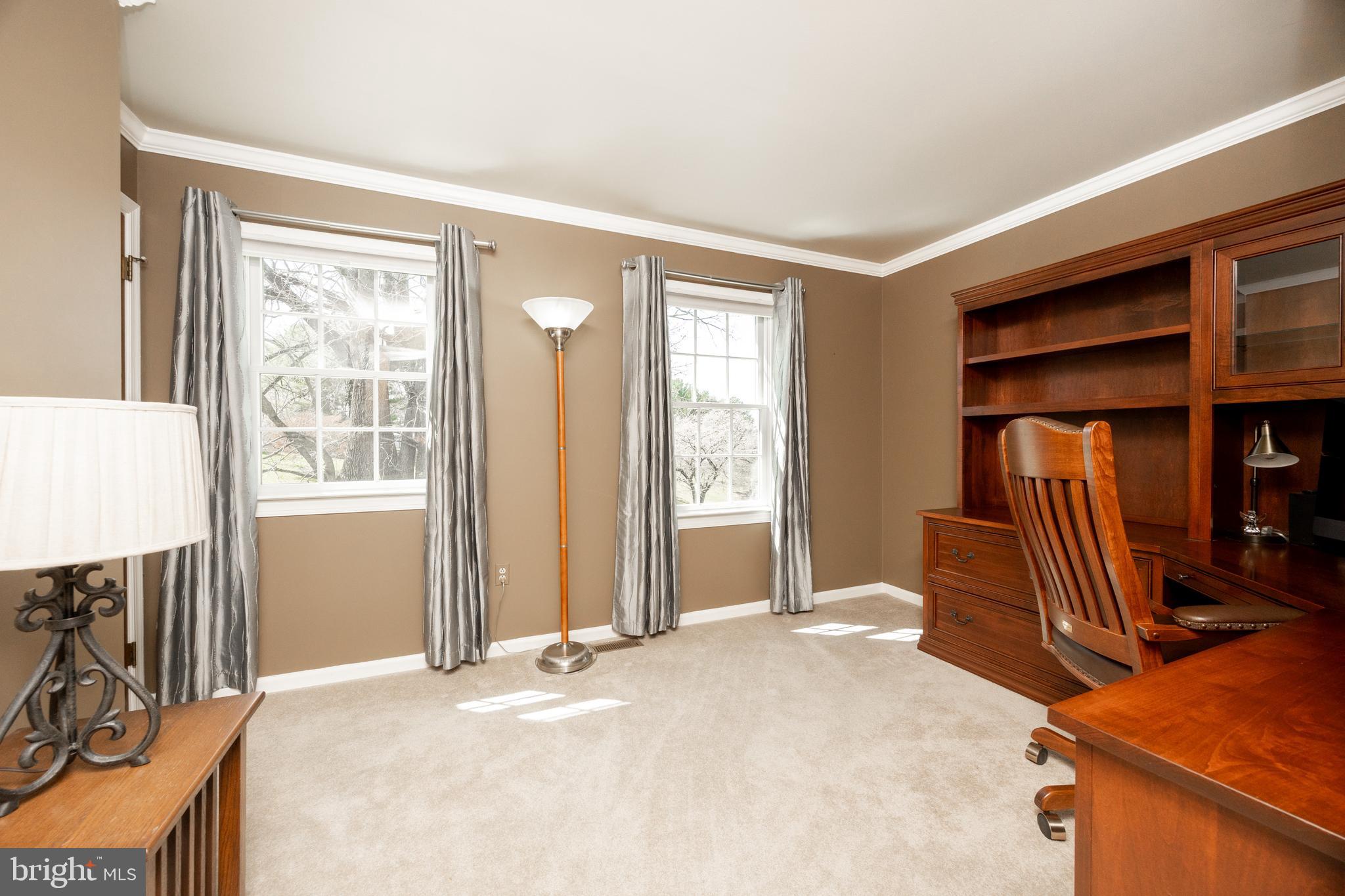 21 Krauser Road Downingtown, PA 19335 - Photo 36 of 54 a bedroom with a bed and a dresser next to a window