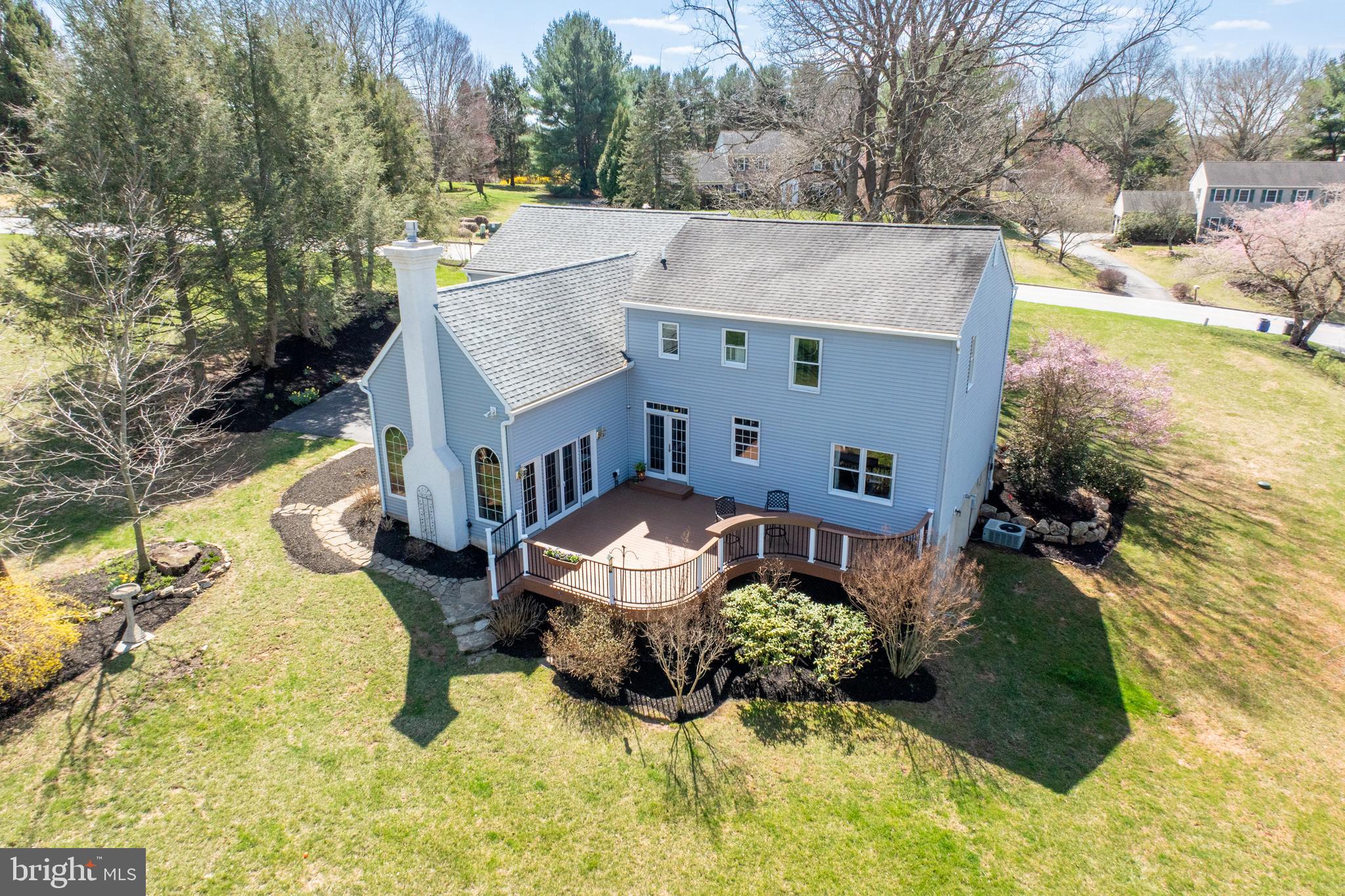 21 Krauser Road Downingtown, PA 19335 - Photo 40 of 54 an aerial view of a house with swimming pool and trees in the background