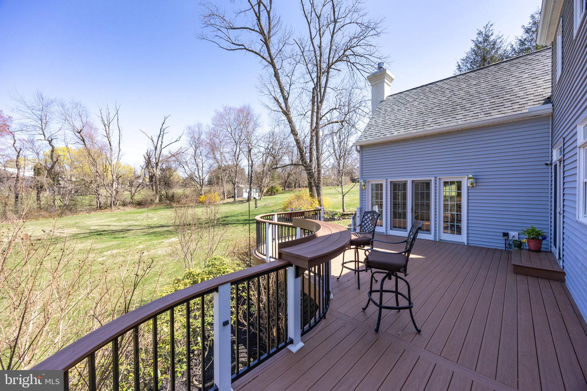 21 Krauser Road Downingtown, PA 19335 - Photo 41 of 54 a view of a chairs and table on the deck in front of house