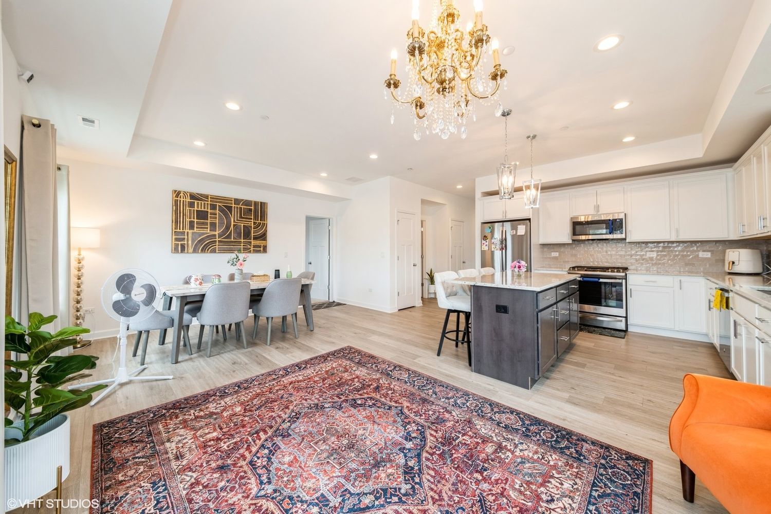 277 Masters Drive Addison, IL 60101 - Photo 5 of 17 a living room with furniture a dining table and kitchen view