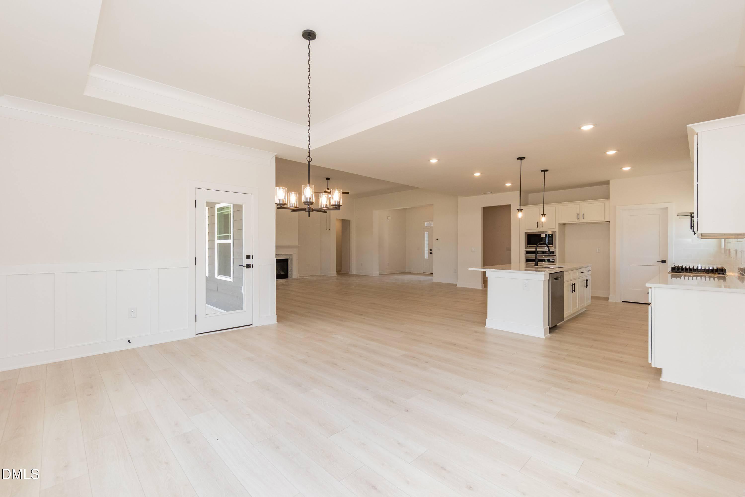 180 Galway Road Lillington, NC 27546 - Photo 15 of 41 a view of a kitchen with a sink and a chandelier