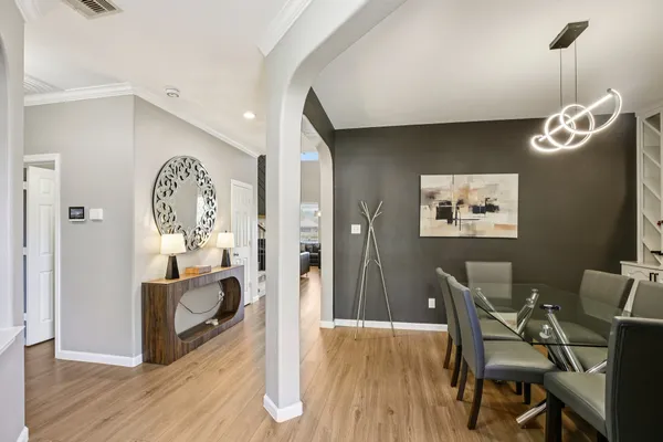 a view of a livingroom with furniture and wooden floor