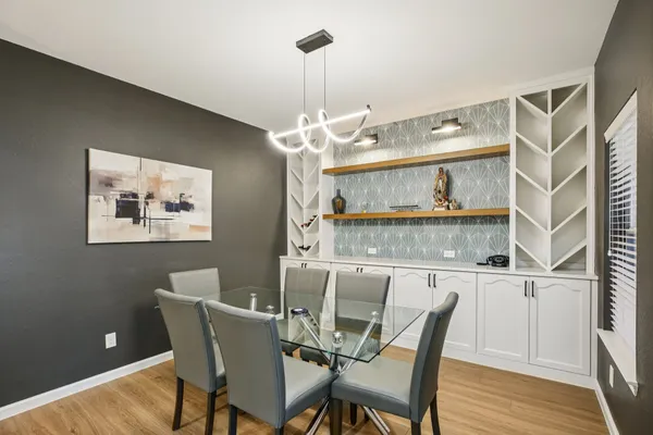 a dining room with furniture and window