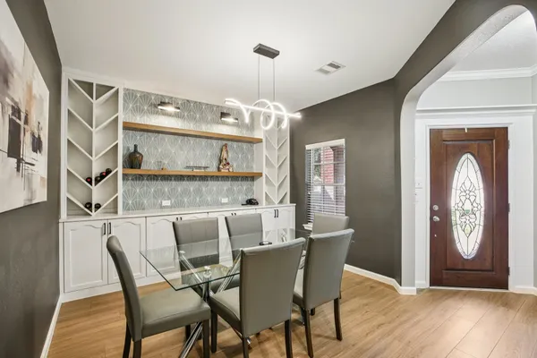 a dining room with furniture and window