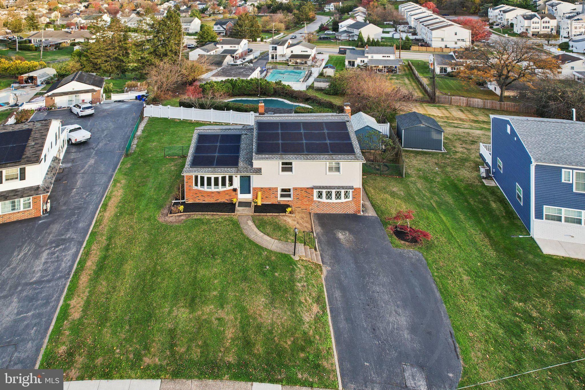 an aerial view of a house with a garden
