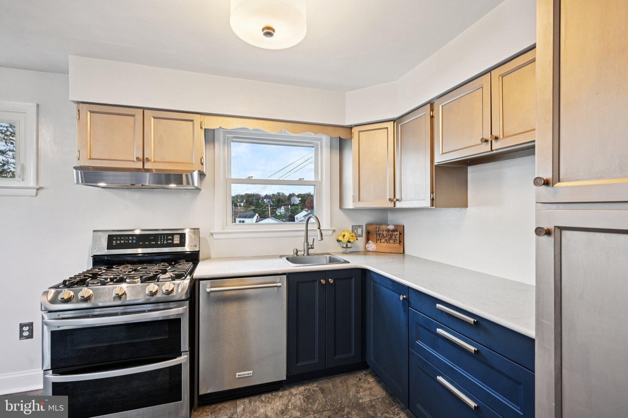 1211 Woodside Road Conshohocken, PA 19428 - Photo 14 of 55 a kitchen with stainless steel appliances a stove a sink dishwasher and cabinets