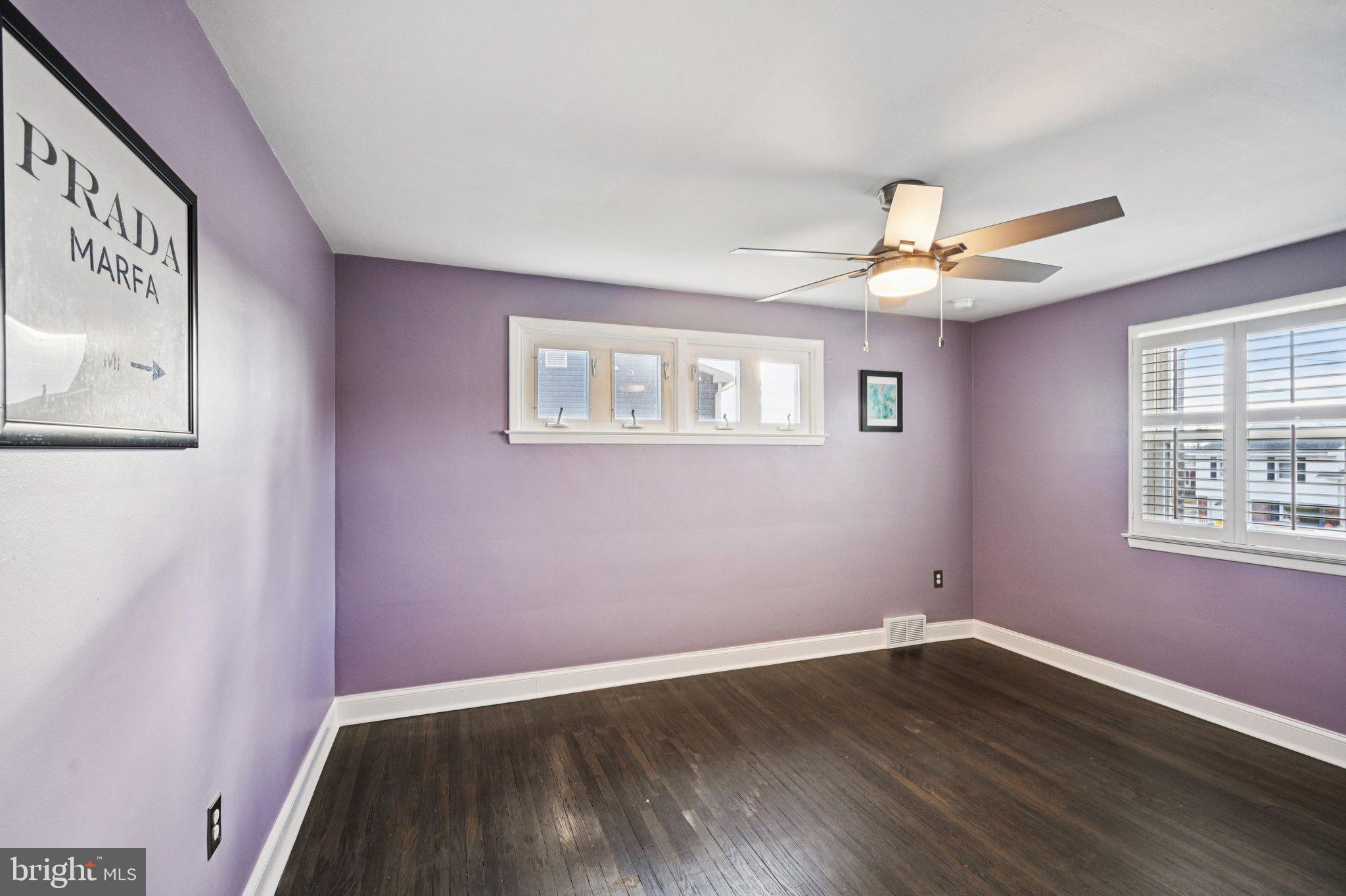 1211 Woodside Road Conshohocken, PA 19428 - Photo 17 of 55 a view of an empty room with wooden floor and a window