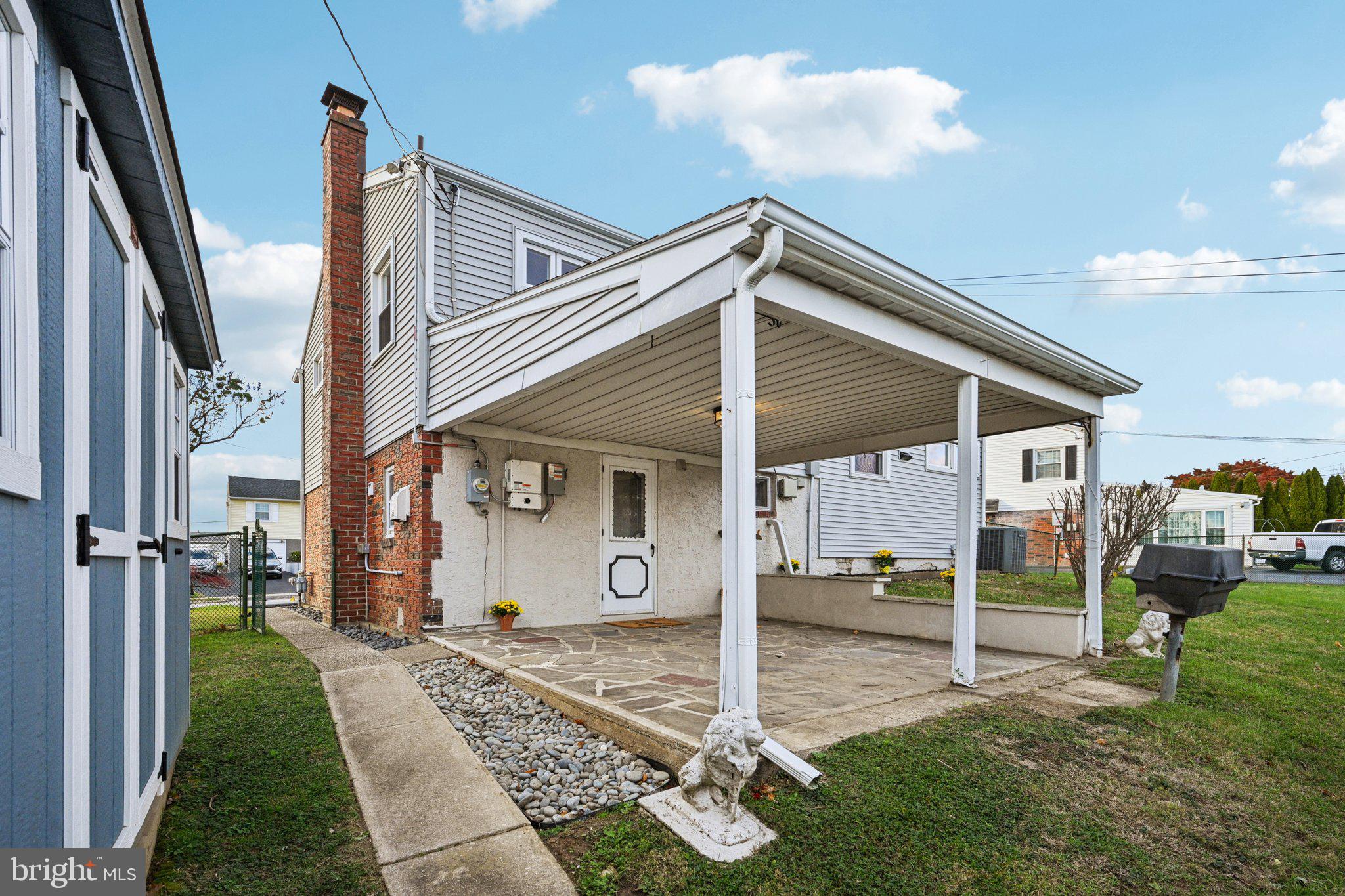 1211 Woodside Road Conshohocken, PA 19428 - Photo 35 of 55 a front view of a house with garden