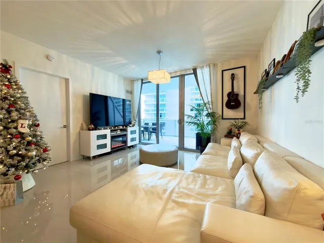 a living room with furniture and a flat screen tv