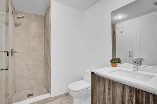 a view of a living room and a wooden floor