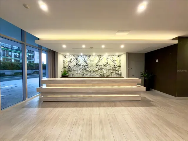 a room with pool table and windows