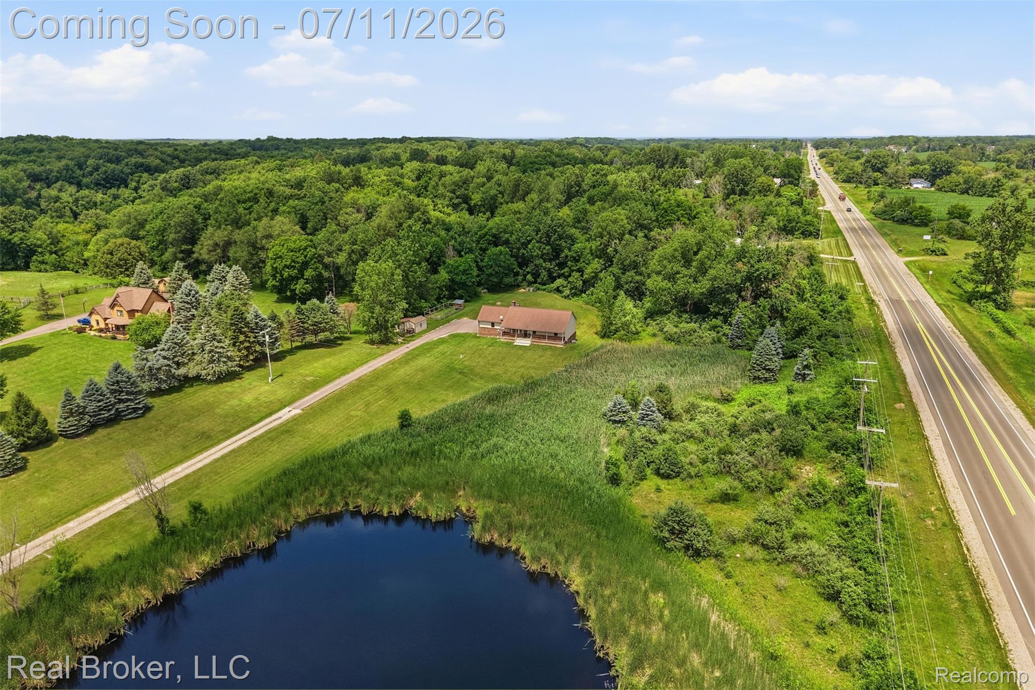 1050 West Brocker Road Metamora, MI 48455 - Photo 4 of 55 Expansive property featuring a private pond, extensive green space, mature trees, and direct road access