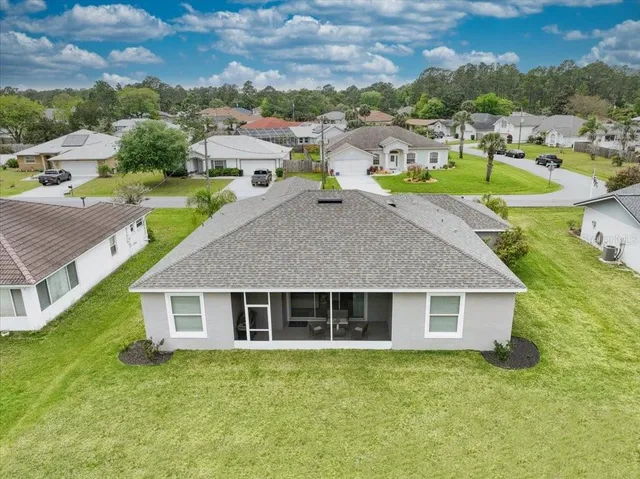 a aerial view of a house with a yard
