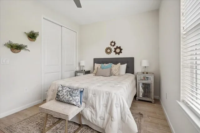 a bedroom with a bed and a window