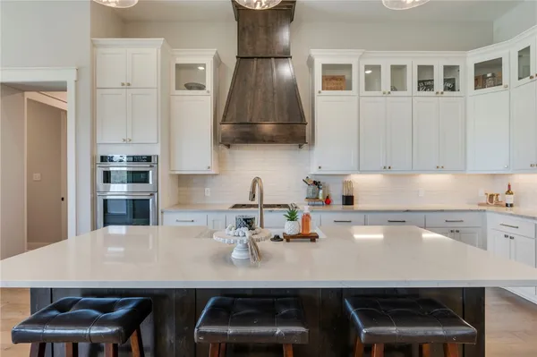 a kitchen with a sink cabinets and appliances
