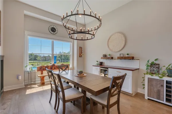 a view of a dining room with furniture window and wooden floor