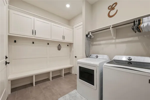 a bedroom with a bed and a tv on the dresser