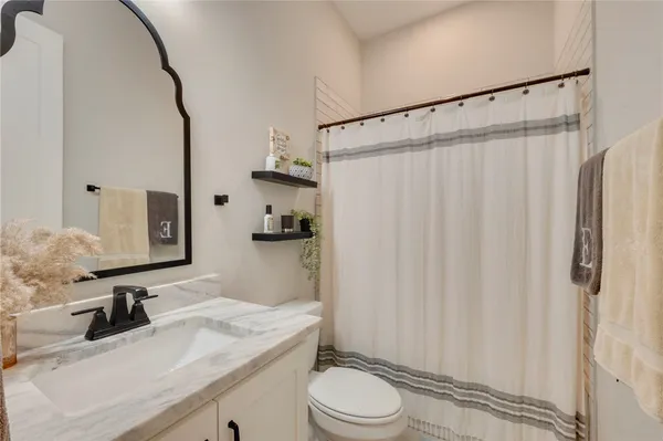 a living room with a couch and a rug