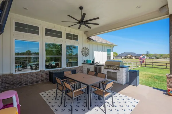 an outdoor space with furniture and garden view