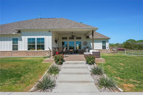 a view of a swimming pool and a yard