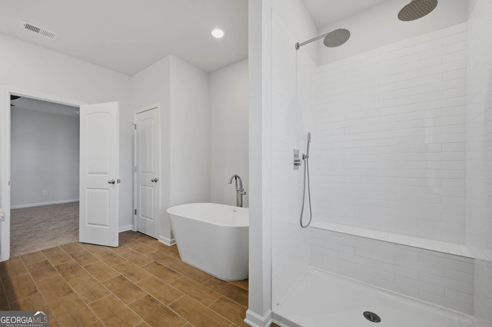 309 Rusty Plow Lane Perry, GA 31069 - Photo 6 of 34 a bathroom with a sink a toilet and shower