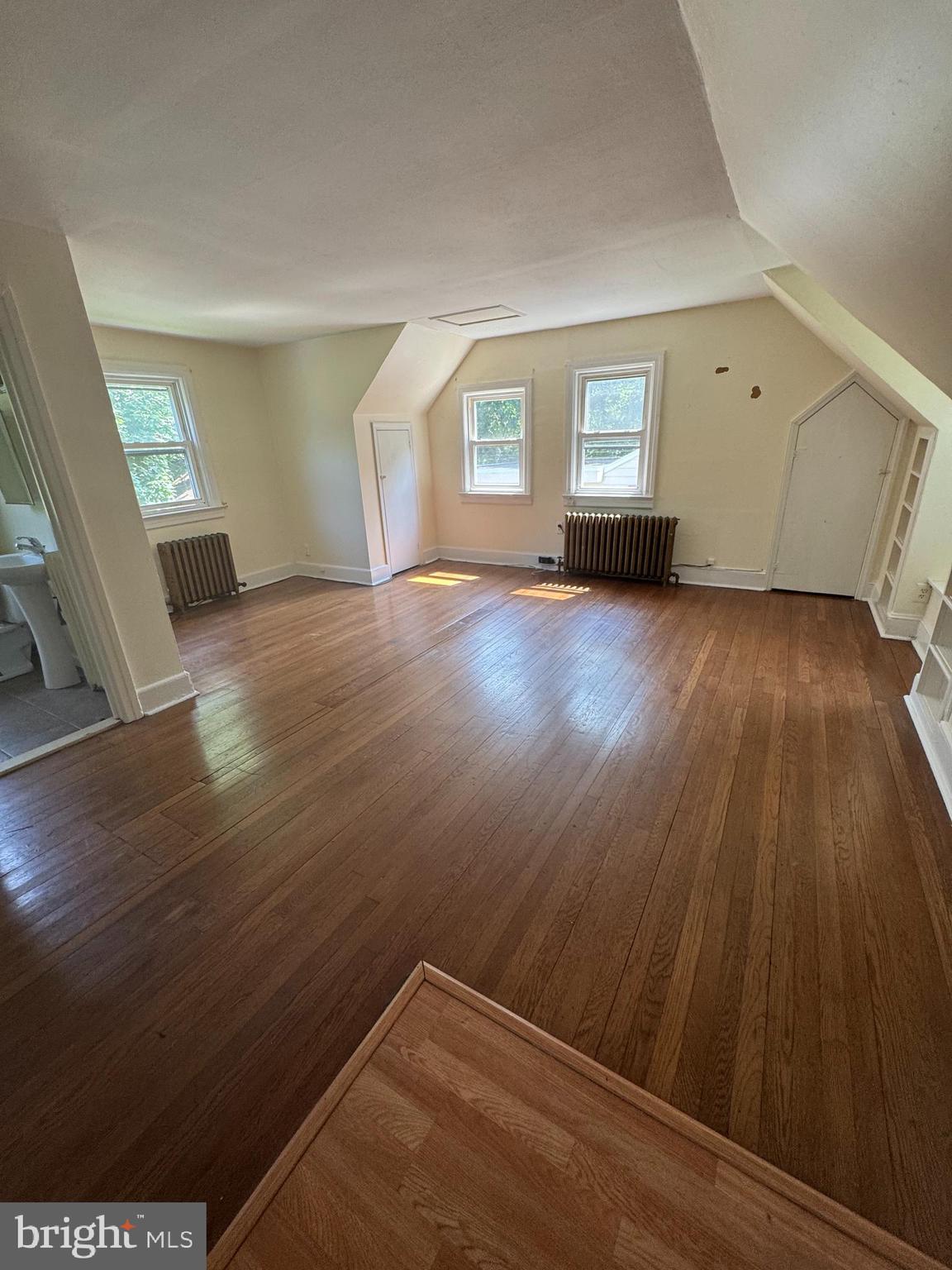 844 Lower Ferry Road, Unit B Ewing, NJ 08628 - Photo 3 of 6 wooden floor in an empty room with a window