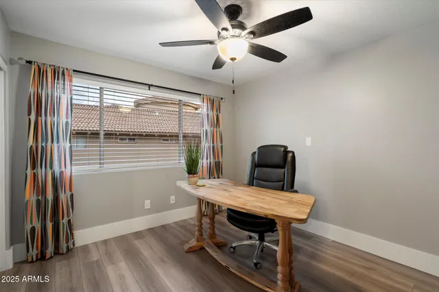 a view of a swimming pool and lounge chairs