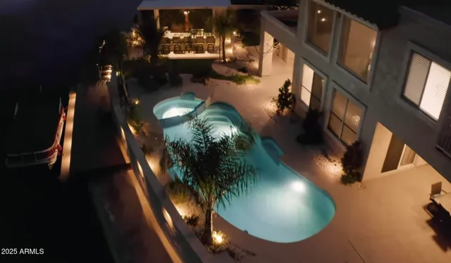 a view of a lake with chairs on roof deck
