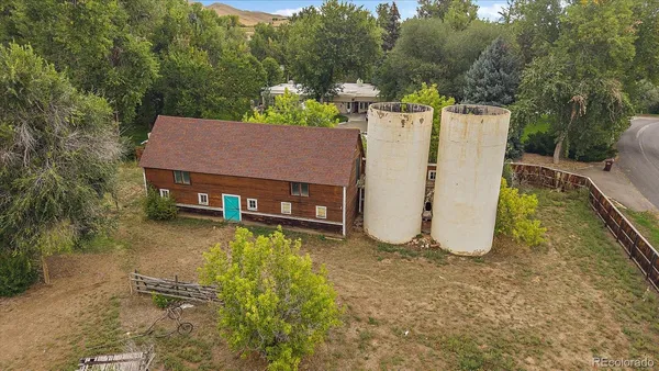 an aerial view of a house with swimming pool garden and patio