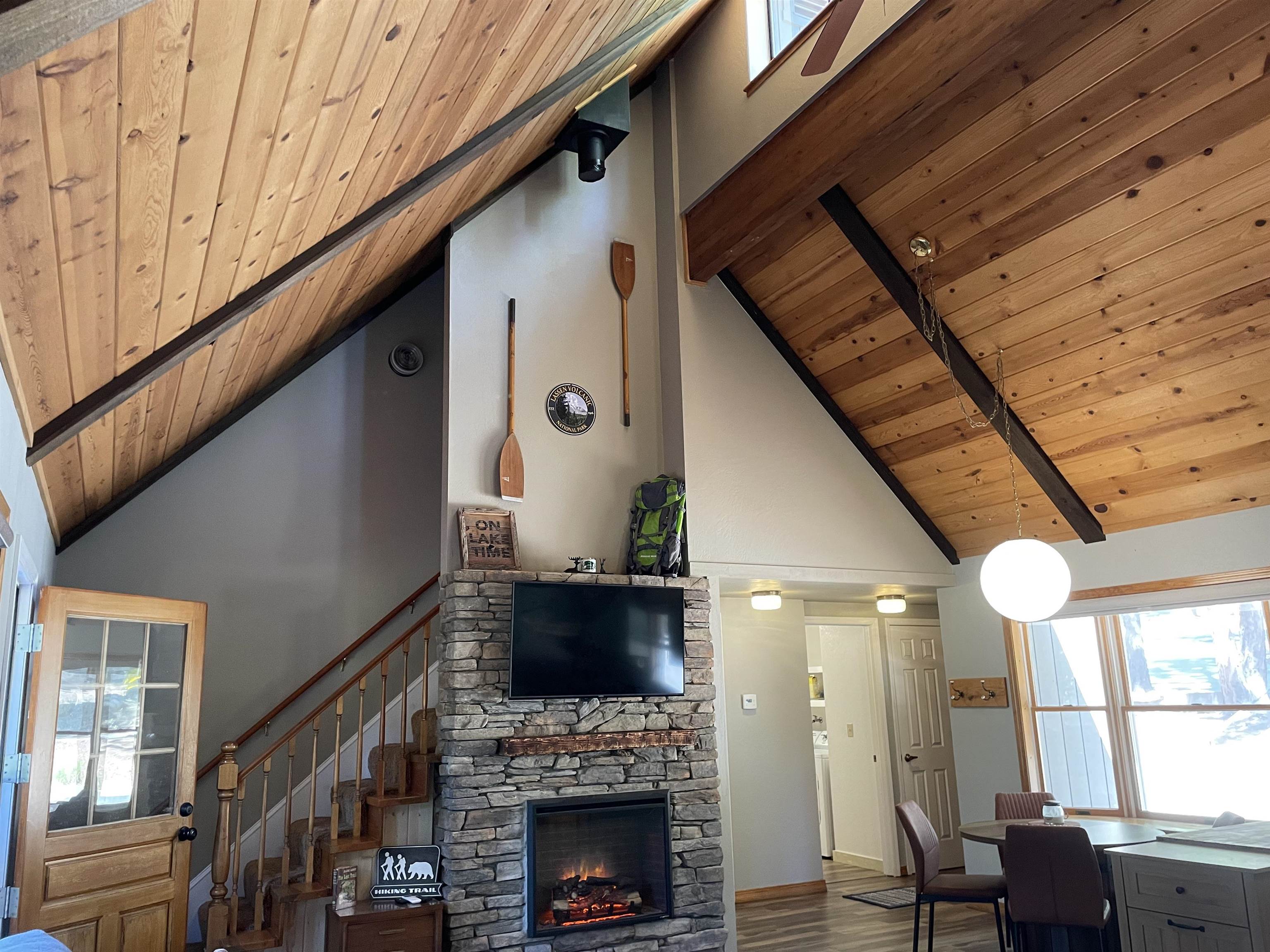 603 East Burnt Cedar Road Lake Almanor, CA 96137 - Photo 10 of 33 a view of living room with furniture and fireplace