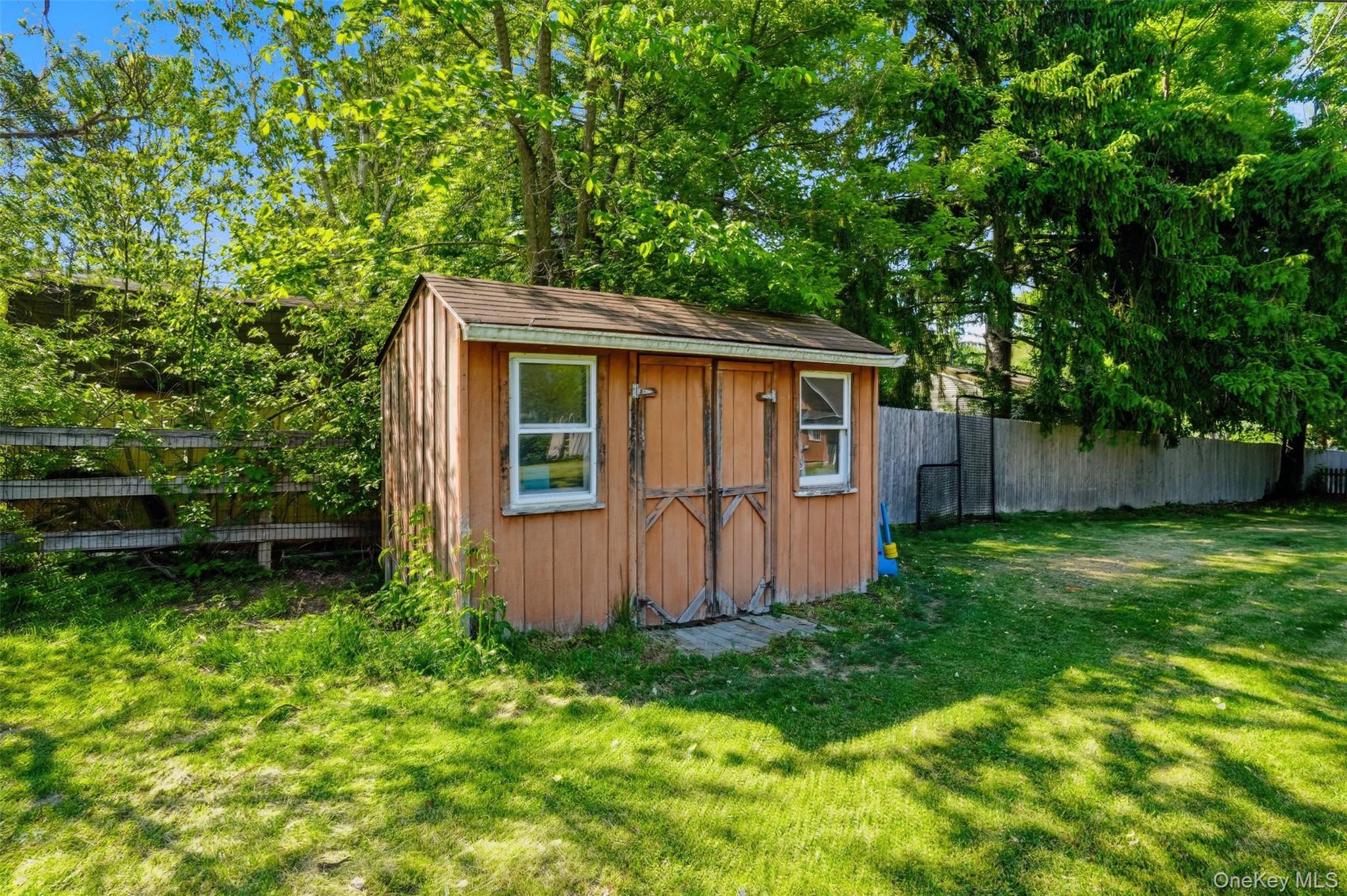 147 County Rte 1 Warwick, NY 10990 - Photo 41 of 45 a view of backyard with potted plants and large tree