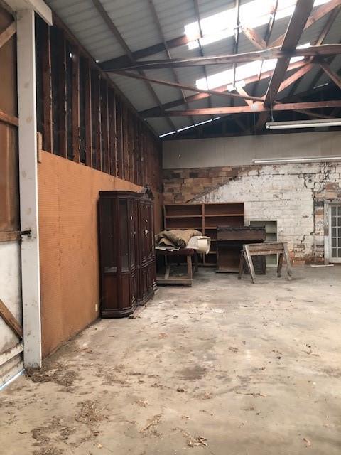 812 West 7th Street Bonham, TX 75418 - Photo 14 of 18 a view of a patio with table and chairs