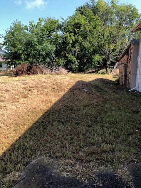 812 West 7th Street Bonham, TX 75418 - Photo 18 of 18 a view of a yard with a tree