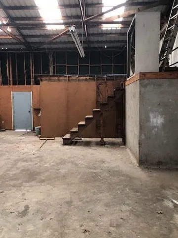 a view of a room with wooden walls