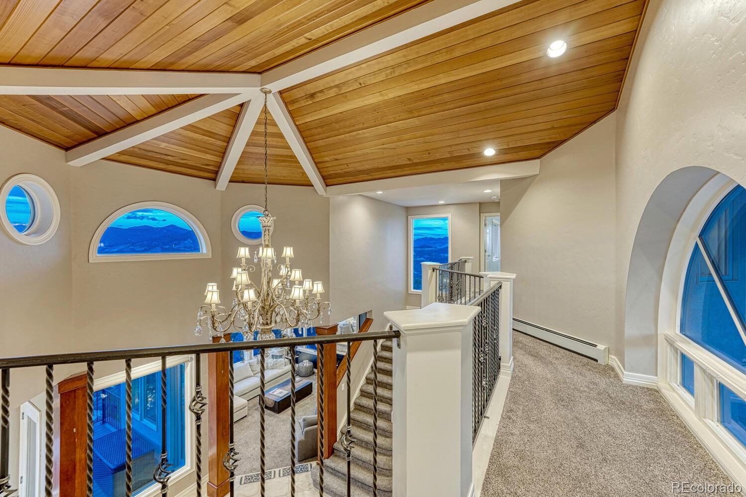 26344 Independence Trail Evergreen, CO 80439 - Photo 16 of 50 a view of a dining room with furniture and chandelier