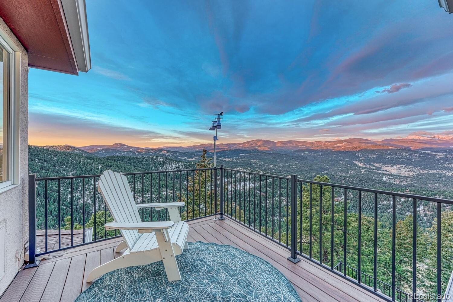 26344 Independence Trail Evergreen, CO 80439 - Photo 21 of 50 a view of a balcony with a garden