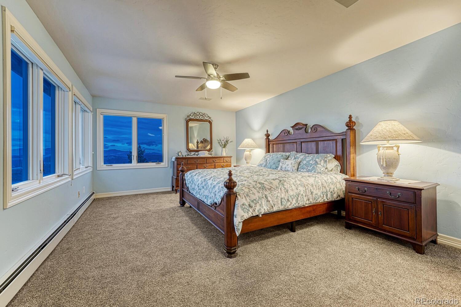26344 Independence Trail Evergreen, CO 80439 - Photo 22 of 50 a bedroom with a bed dresser and a window