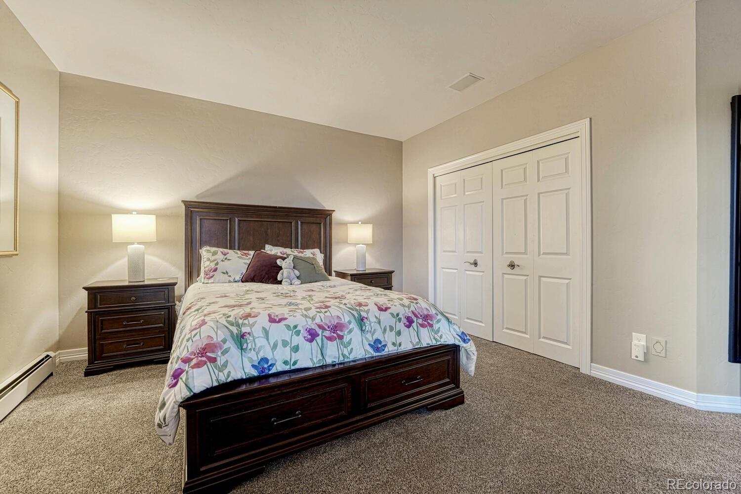 26344 Independence Trail Evergreen, CO 80439 - Photo 25 of 50 a bedroom with a bed and window