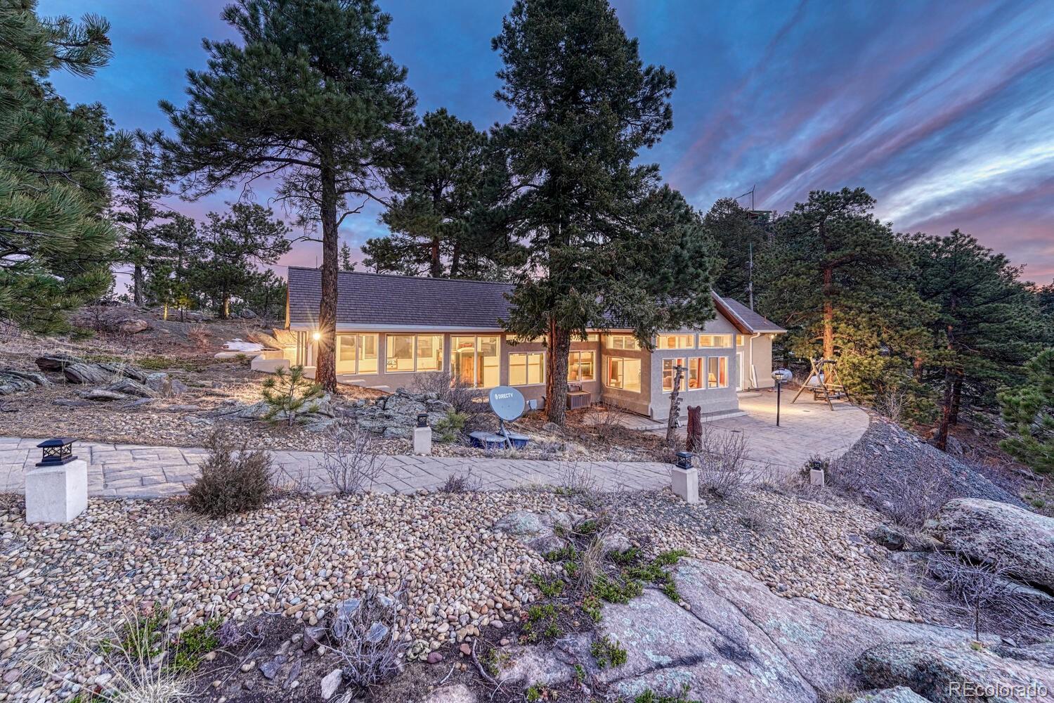 26344 Independence Trail Evergreen, CO 80439 - Photo 30 of 50 a view of a house with a yard