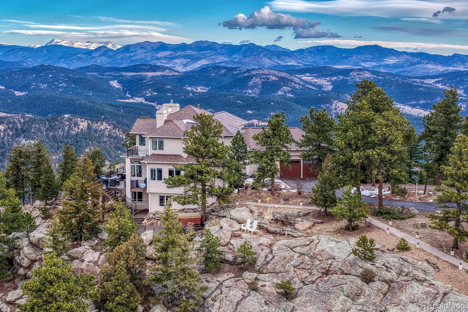 26344 Independence Trail Evergreen, CO 80439 - Photo 43 of 50 a view of a house with a yard