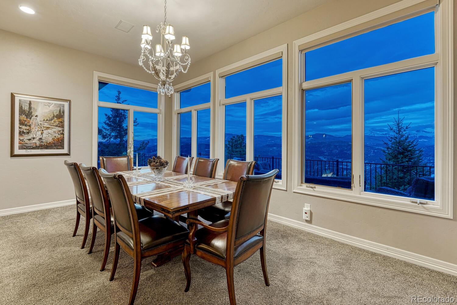 26344 Independence Trail Evergreen, CO 80439 - Photo 7 of 50 a view of a dining room with furniture and chandelier